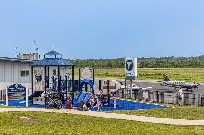 Kids of Westwood can enjoy the fun playground with planes taking off in the back in Norwood Memorial Airport.