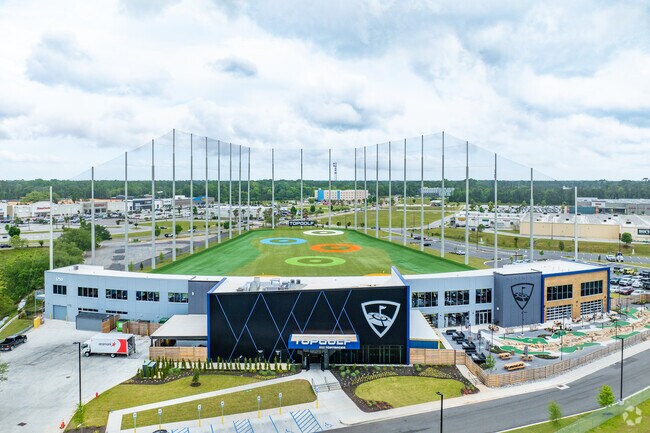 Practice your swing at the Top Golf near Midtown Mobile.
