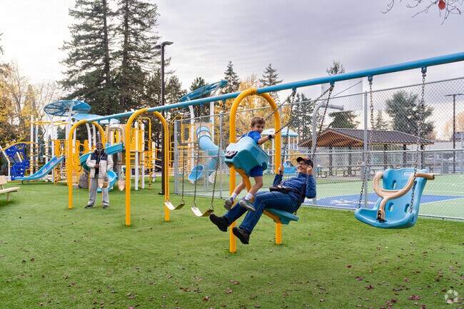 Jessie Mays Community Park features a playground and open green space for family fun.