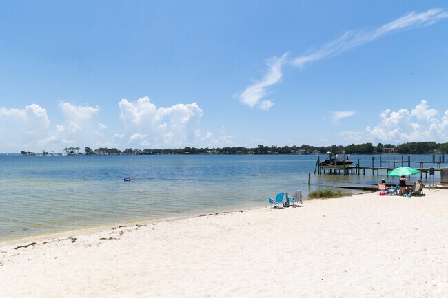 The white sand beaches in Garnier Beach Park make it a great spot to sunbathe.