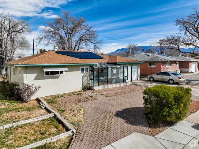 The distinctive stucco home with a sunroom adds personality to Hodgin, NM's landscape.