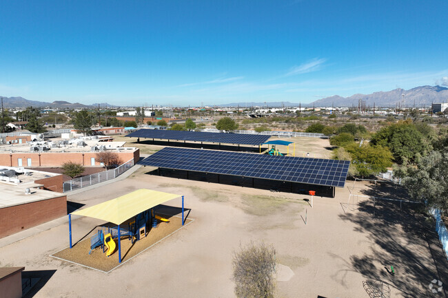 There is a large field for students to run around in at Los Niños Elementary School.