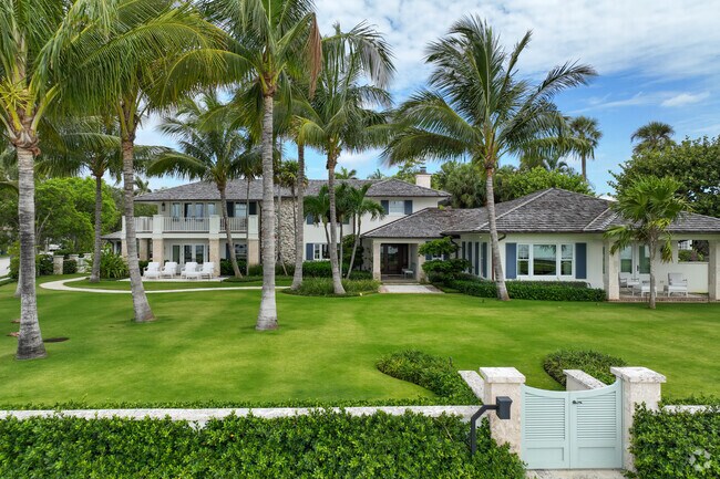 Large waterfront property with a perfectly manicured lawn in South End neighborhood.