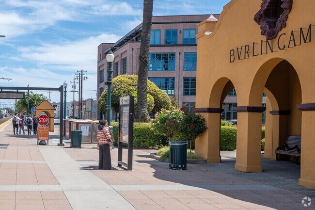 Commuters check train times at the busy Burlingame Train Station.