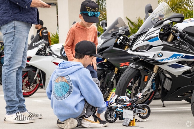 Kids love the motorbikes, even little Lego ones, at South OC Cars and Coffee held every Saturday in Outlets at San Clemente southern parking lot.