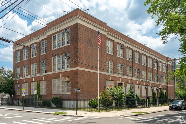 Full exterior of P.S. 015 Jackie Robinson from 121st Ave.