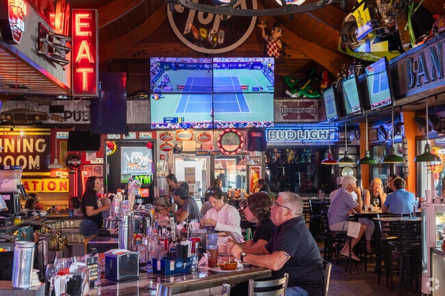 Motorheads Bar and Grill serves upscale tavern food in an automotive garage setting.