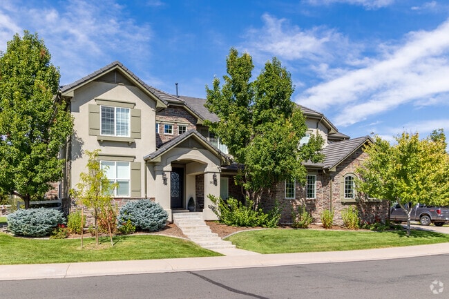 A four-bedroom home in Huntington Trails neighborhood sits stoically.