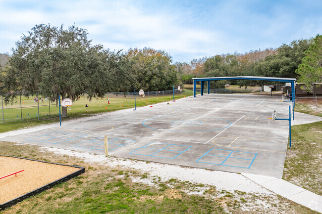 Students enjoy outdoor play on the sports courts at Brooker Creek Elementary.