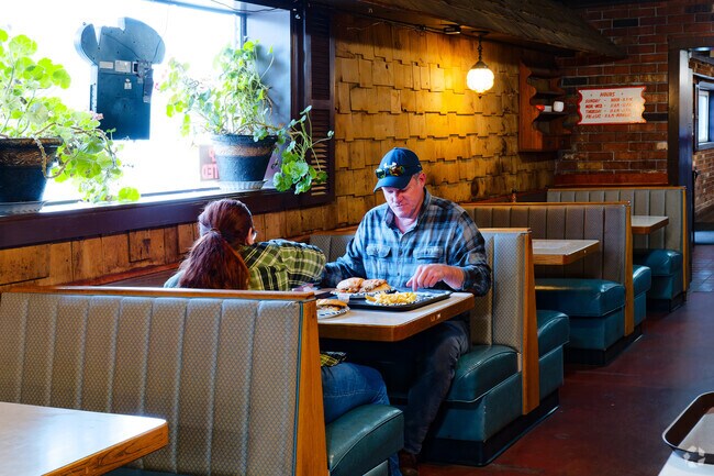 A couple enjoys lunch together at Campi's in the19th Ward.