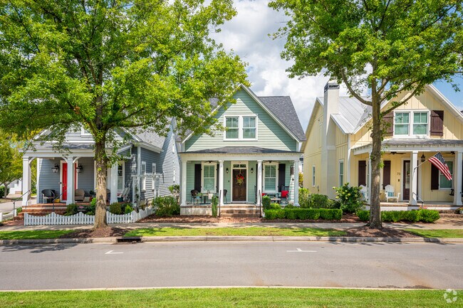 Ornate Victorians line the streets of Hammonds Ferry in a variety of colors.