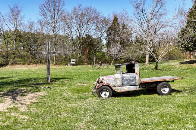 An antique truck sits in the yard of a Friendsville home.