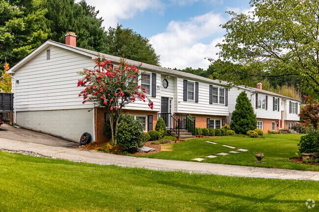Cozy row of split-level homes with quaint landscaping on Cannon Road in Colesville.