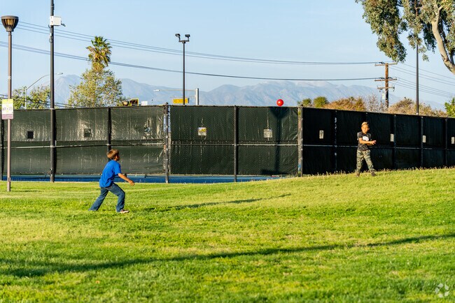 Laughter and teamwork shine as families play baseball at Woodland Park in Armada, Moreno Valley.