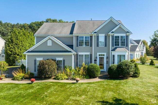 Colonial home with mature landscaping on Fairway Drive in Northbridge.