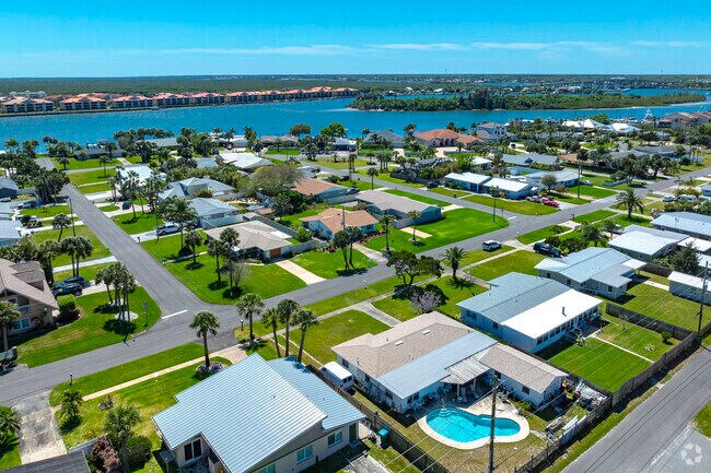 These rows of homes in Buena Vista Shores enjoy neatly manicured yards and native Florida palms.