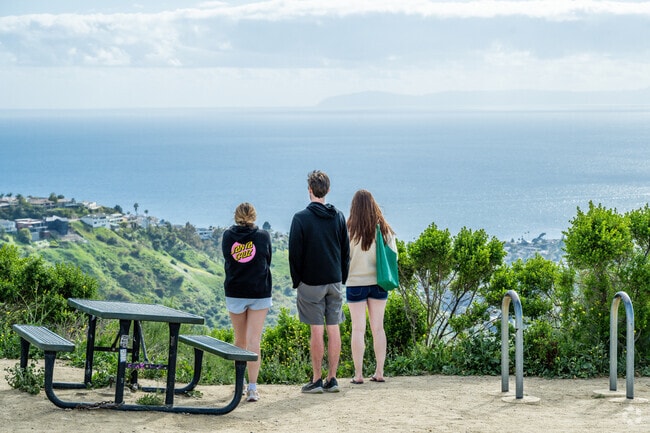 The Top of the World trails feature picnic tables and seating, while soaking in breathtaking ocean views.