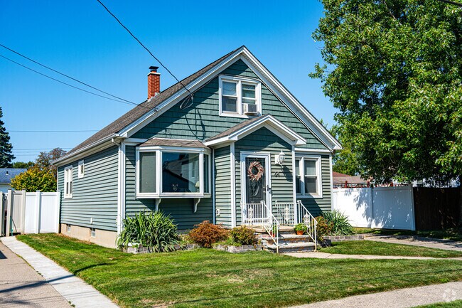 Many homes in Sloan have shallow front yards on residential streets lined with sidewalks.