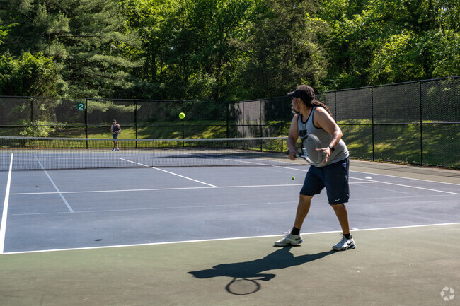 Play a tennis match at Guilford Park in Savage.