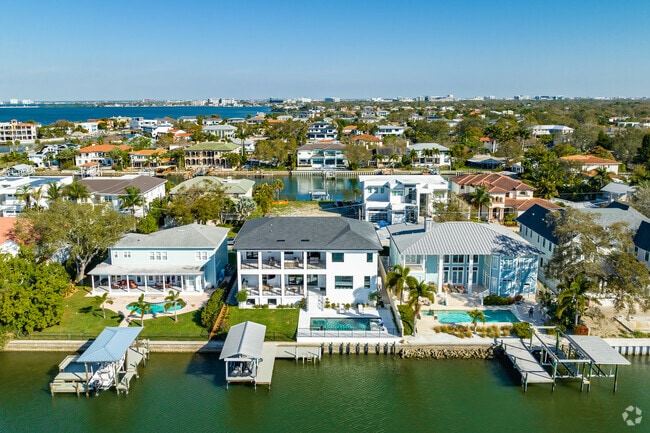 Overhead view of rows of grand  estates with private boating docks.