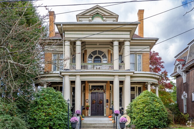 This interesting neoclassical home is tucked behind foliage in the town of Freeport.