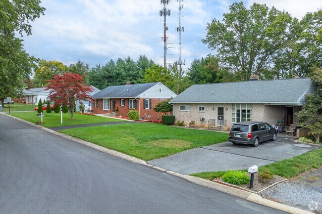 Modest ranch homes line the quiet residential streets of Quaker Hills.