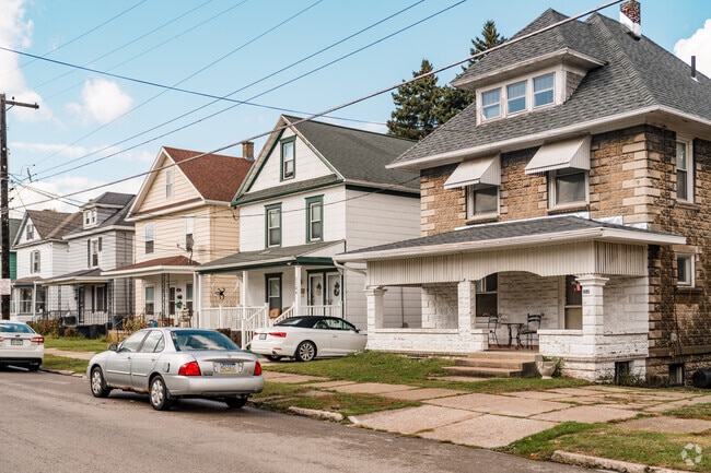 Single and multi-family homes in Marvintown sit along sidewalk lined streets.