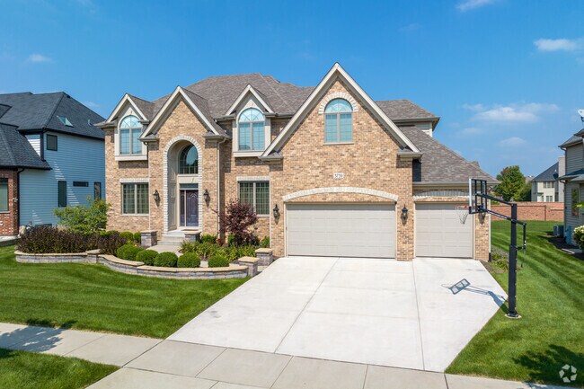 A glowing Tudor-inspired style home that is a popular home style in Timber Creek.