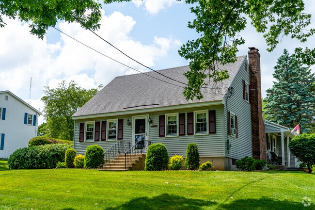 Cape Cod style home across the street from Pakachoag Golf Course.