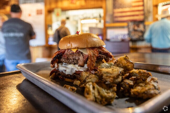 The Badass Burger at Rustler's BBQ includes beef patties, brisket, mac and cheese and more