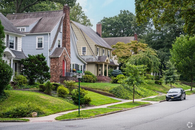 On Hawthorne Ave, mid-size homes sit on larger properties with ample greenery.