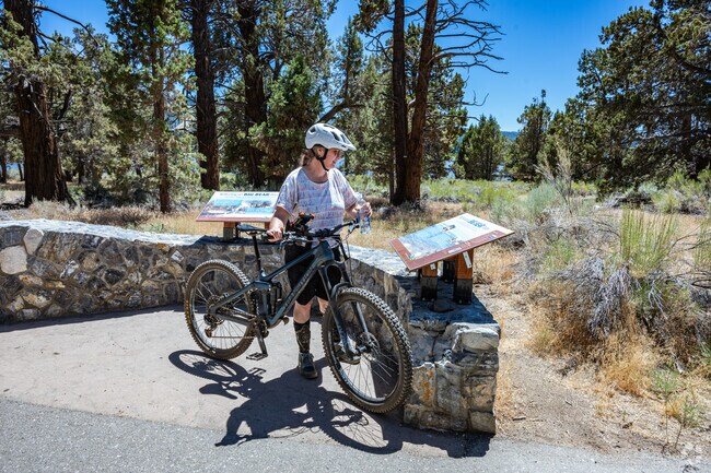 Trail signage near Big Bear Lake provides biking and hiking info for exploring the San Bernardino National Forest.