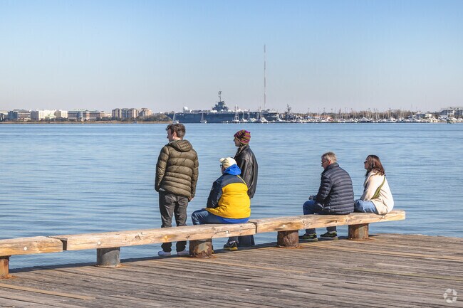 French Quarter families enjoy the scenic views of the harbor at Joe Riley Waterfront Park.