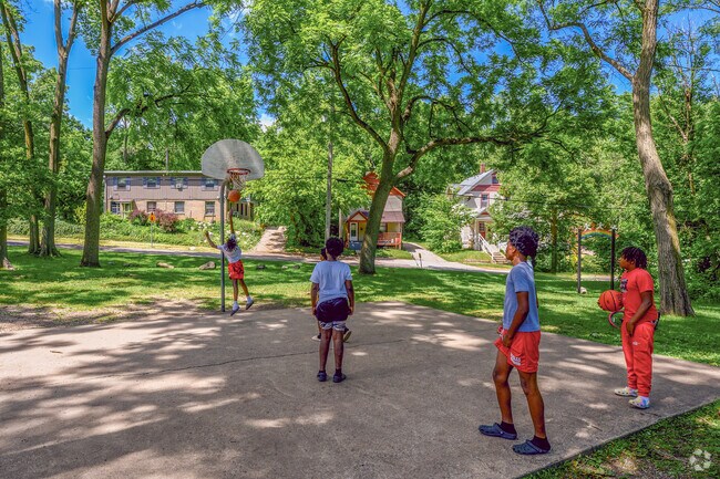 A group of children engage in a game of basketball in Adda Dilts Peace Park in West Douglas.