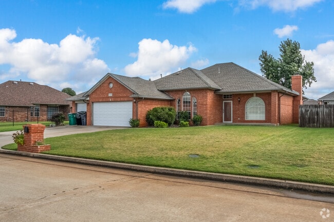 Frolich Meadows Estates typical home with a large front yard on a quiet street.