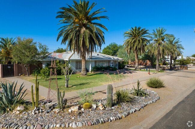 Some homes in Coolidge feature a mix of desert and turf landscaping.