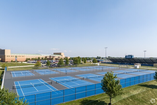 Eight tennis courts on the campus of Oswego East High School.