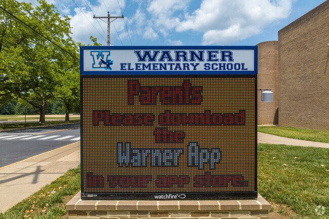 The entrance sign welcomes students at Warner Elementary School in the Triangle neighborhood.