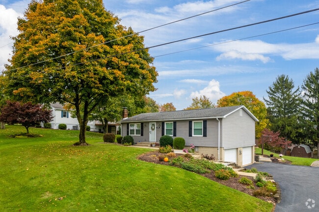 A raised ranch home taking advantage of East Franklin Township's hilly terrain.
