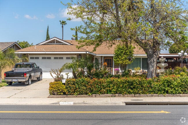 In Arlanza, a beautiful ranch-style home is surrounded by trees, creating a picturesque setting.