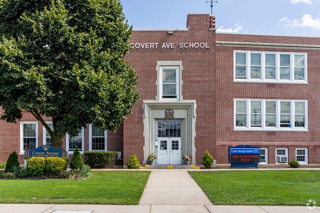 Greenery is lush at Covert Avenue Elementary School's entrance.