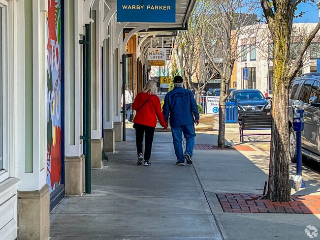 Couples young and old go to Easton Town Center to explore the local shops.