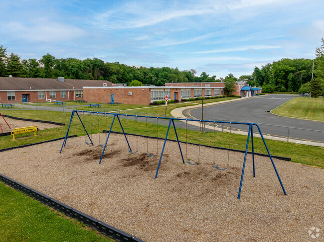 Robertsville Elementary School shares a playground with Asher Holmes Elementary school.