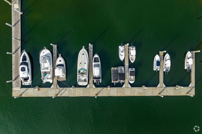 Local boats are parked around Sun Bay South.