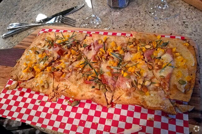 Pair your favorite wine with delectable, homemade flatbread at Evelyn's Wine Bar.