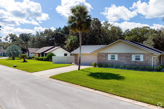 Pristine landscaping and pride of ownership can be observed on this row of Northbrook homes.