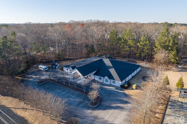 Oak Hill Classical School is surrounded by nearby neighborhoods and mature trees.