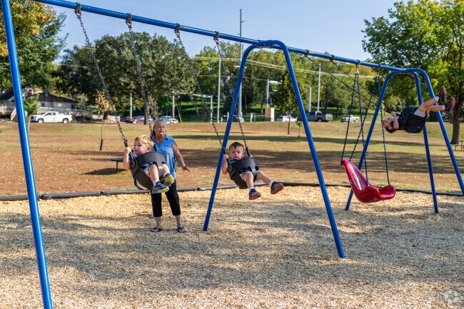 Kids can play on the open fields or the playground at Sherman Park.