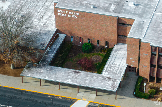 Robert E. Melican Middle School has a green courtyard entrance.