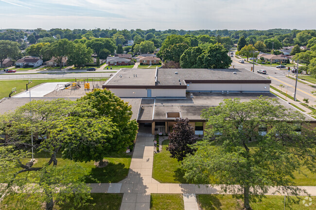Racine Christian School is surrounded by large trees.